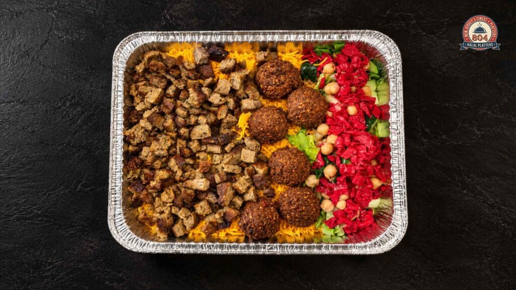 Halal platter with seasoned chicken, rice, falafel, and fresh salad served in a takeaway tray.